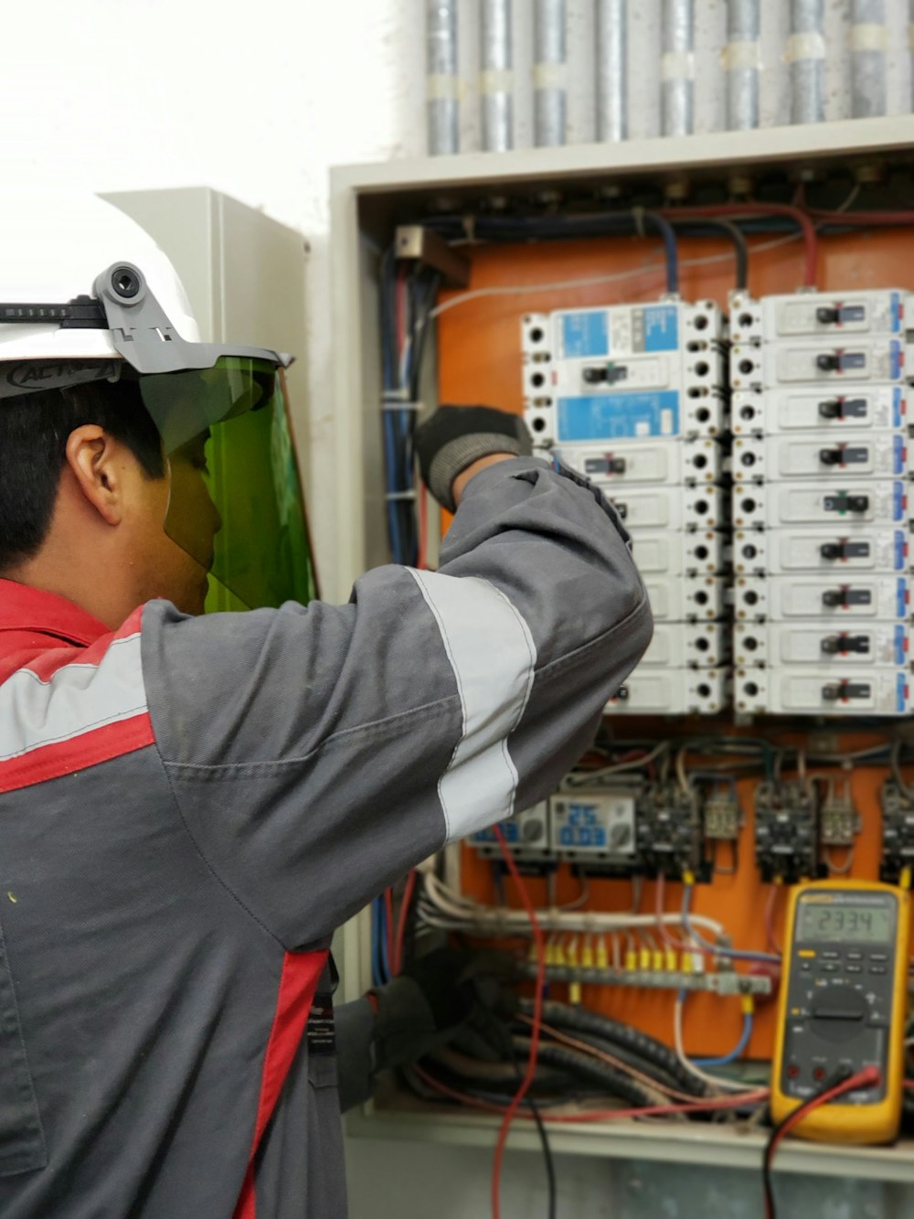 American Heating and Air — HVAC technician servicing an air conditioning system